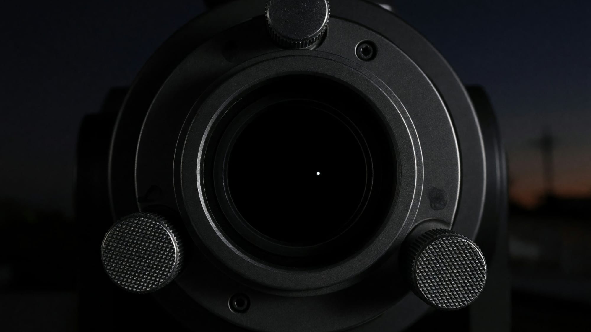 The polar alignment end of an equatorial mount at night